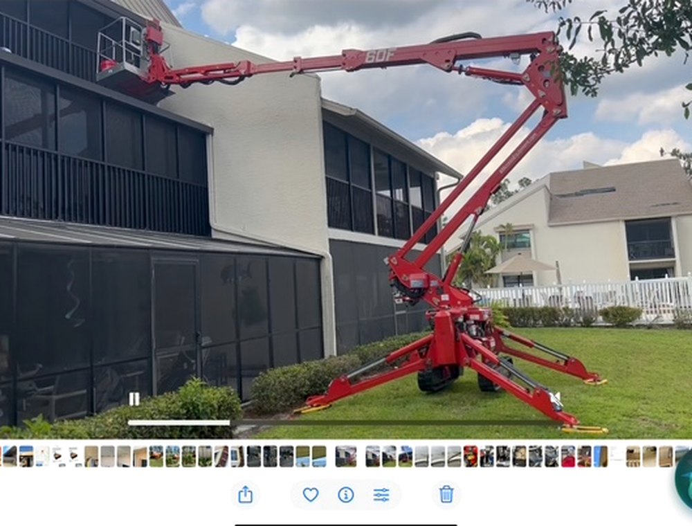 Crew working from a lift on an exterior commercial project.